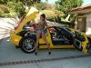 Exotic_car_with_brunette_model.jpg